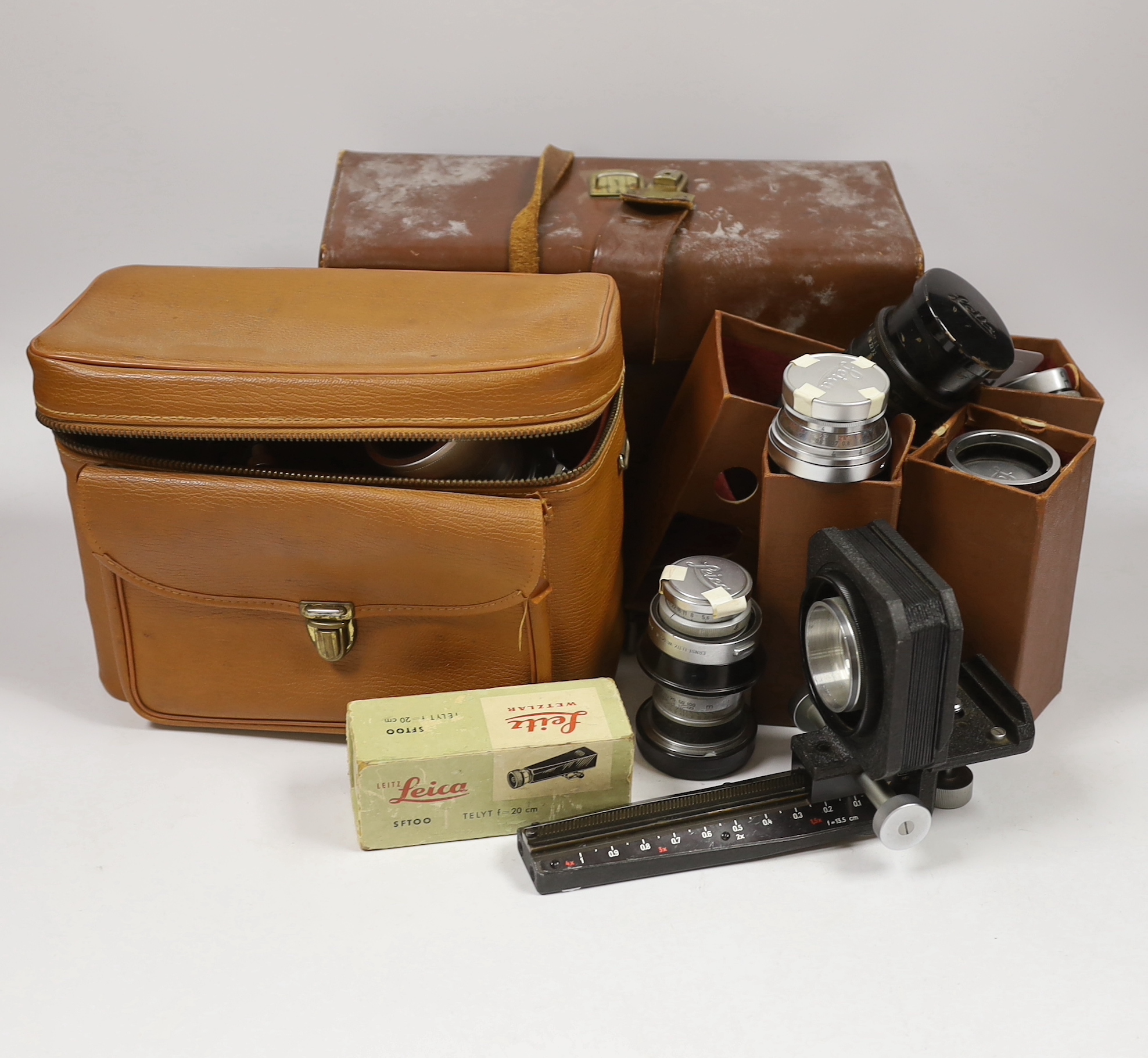 Leica accessories including; a Leitz Visoflex I and Visoflex II, a Summarit f-5cm 1:1.5 lens, an Elmar f=9cm 1:4lens, a Super Angulon 1:4/21 lens, a Range Finder, a Leitz Telyt f=20cm 1:4.5 lens, a Leitz Telyt SFT00 view